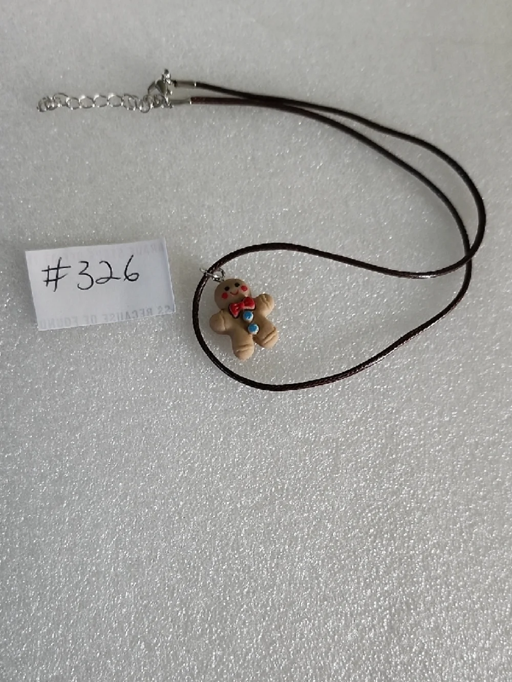 Hand Crafted Brown Gingerbread Man Necklace with Red and Blue Accents